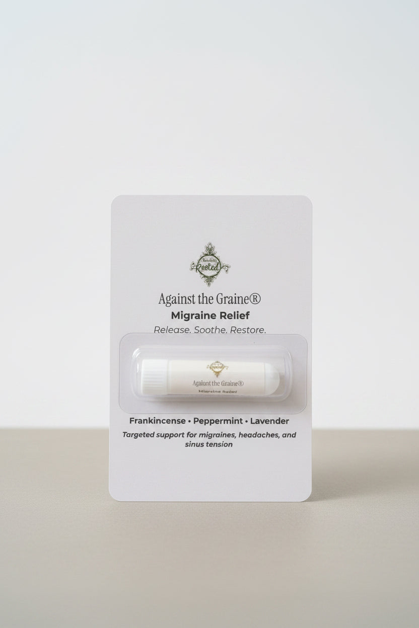 Migraine relief product packaging with visible branding on a neutral surface.