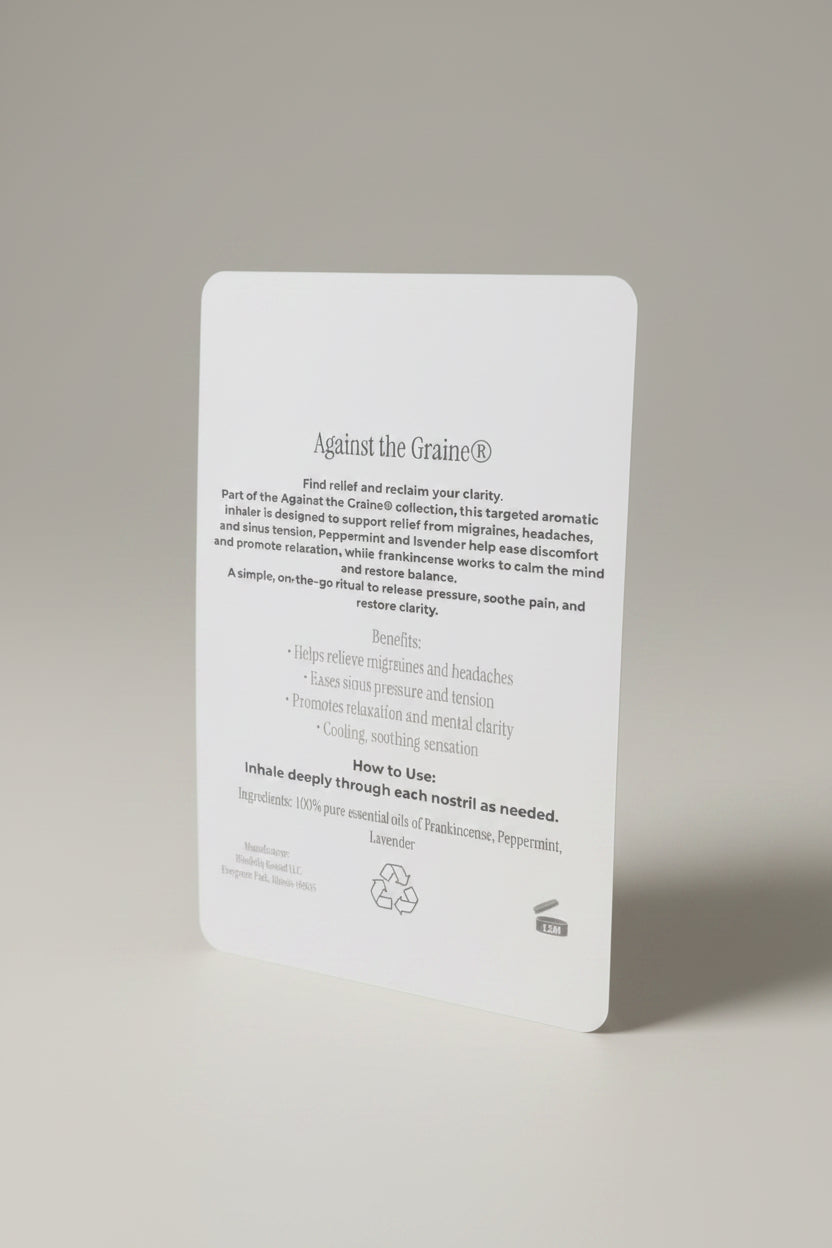 Card with text about a product called 'Against the Graine' on a neutral surface.