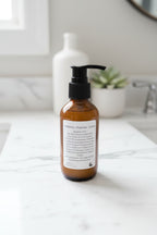 Brown bottle with black pump on a wooden surface