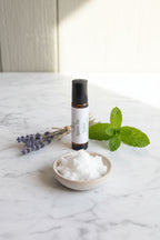 Against the Graine Roller with lavender and peppermint leaves