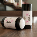 Two 'Aloha' branded products on a wooden surface with shelves in the background.