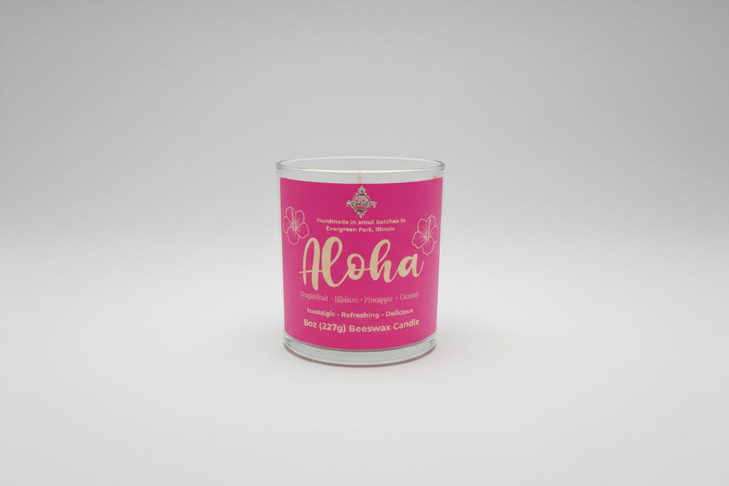 Candle with pink label on a whiteboard te background l.