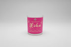 Candle with pink label on a whiteboard te background l.