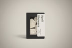 Box of 'April Showers' wax melts with a label on a neutral background.
