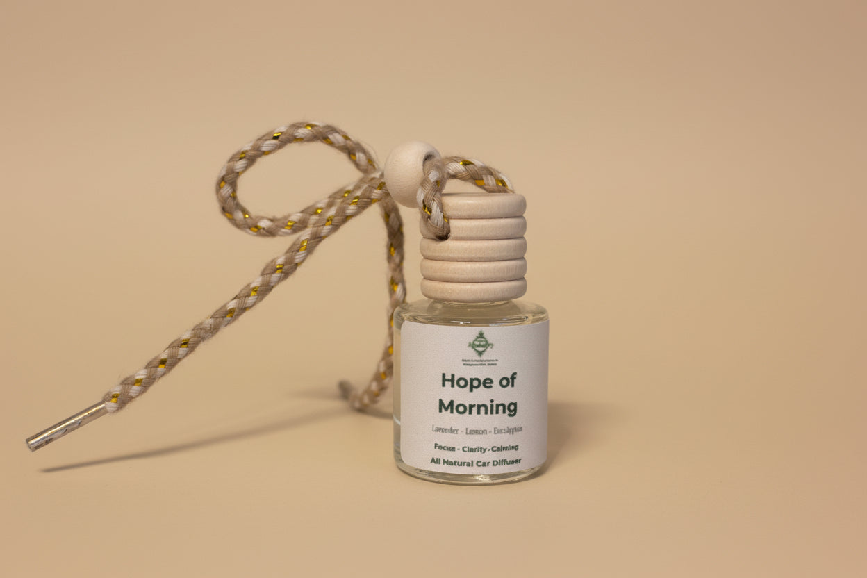 Small bottle labeled 'Hope of Morning' with a strap on a neutral background