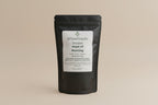 All Natural Laundry Detergent package labeled 'Hope of Morning' on a shelf.