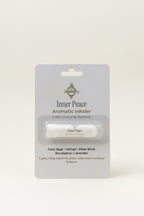Aromatic inhaler on a card with 'Inner Peace' branding on a white surface.