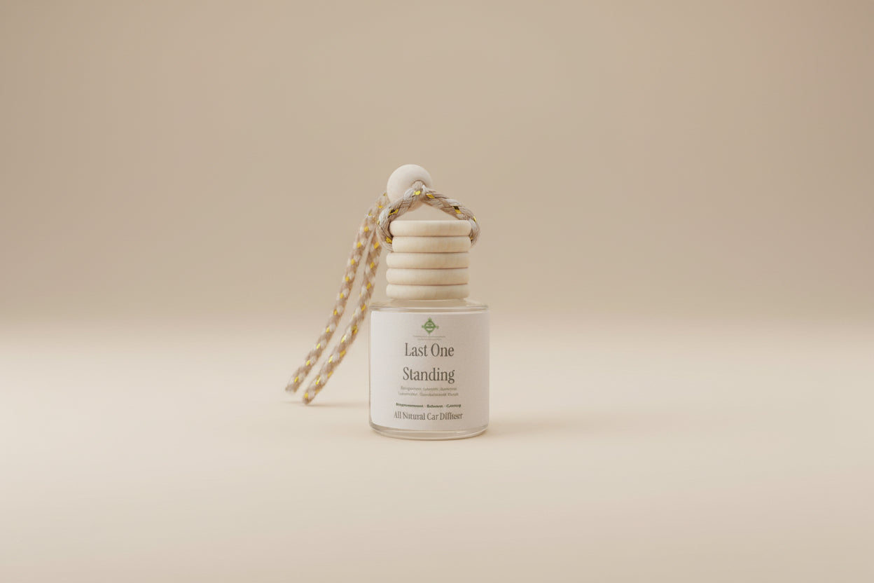 Candle labeled 'Last One Standing' with a decorative element on a neutral background