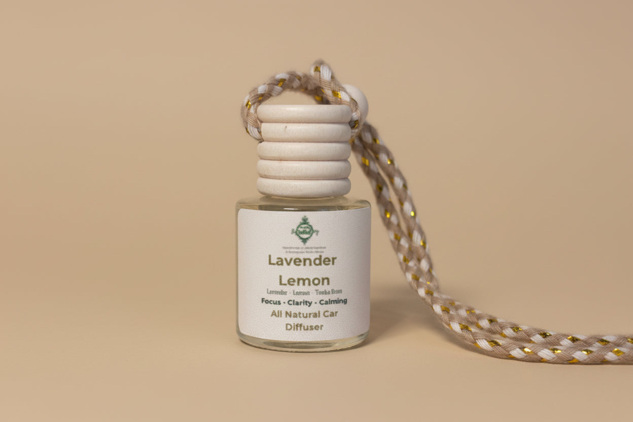 Small glass diffuser bottle labeled 'Lavender Lemon' with a cord on a neutral background