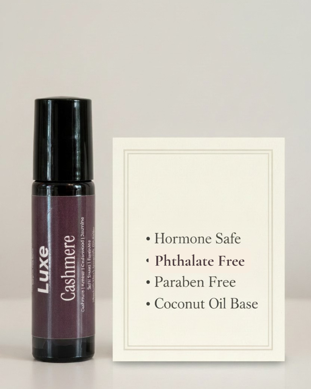 Luxe Cashmere roll-on bottle with product information on a light gray background