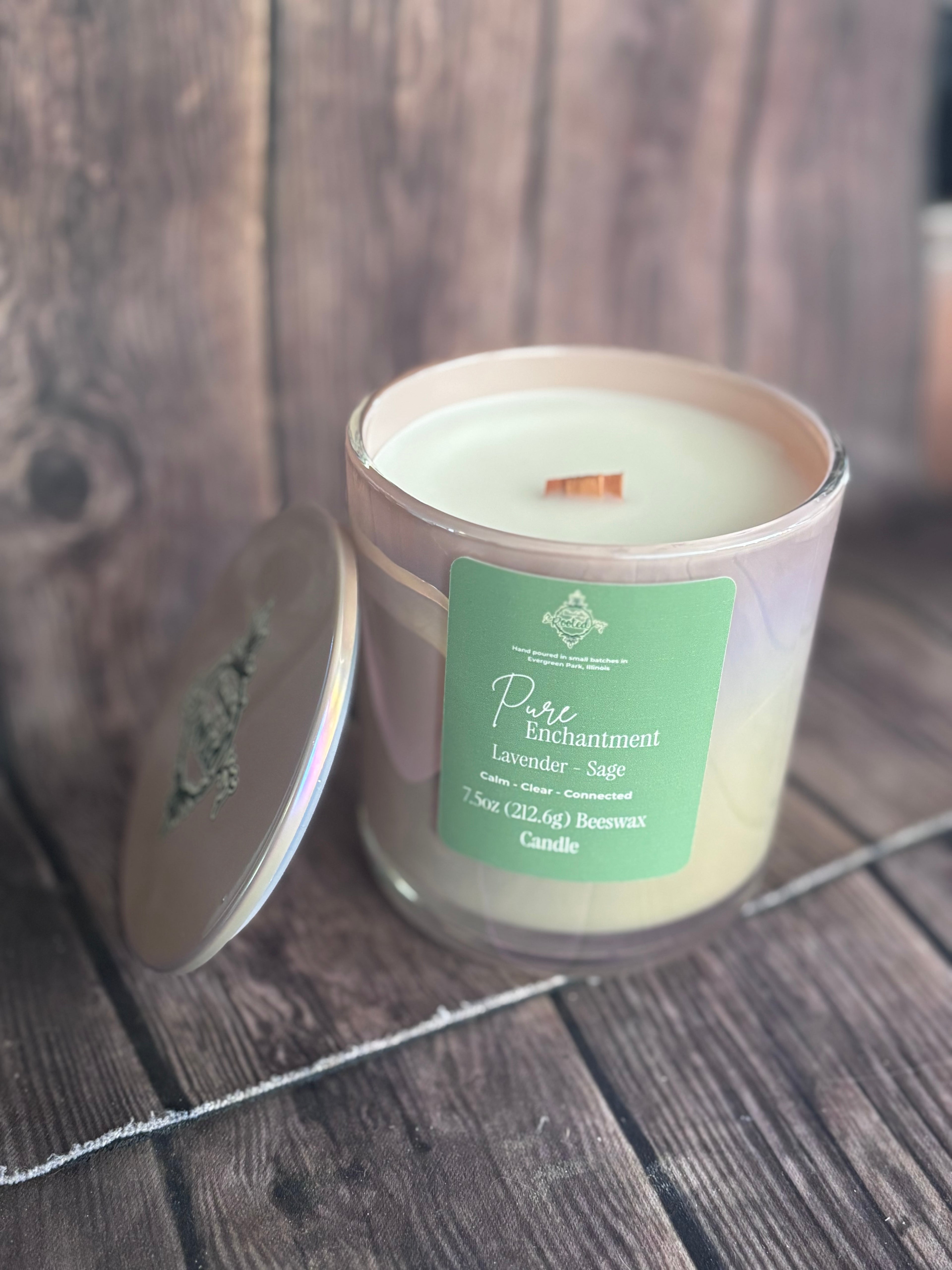 Candle in a glass jar with a green label on a wooden surface