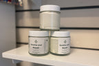 Three jars of 'Soothe and Repair' cream on a shelf.